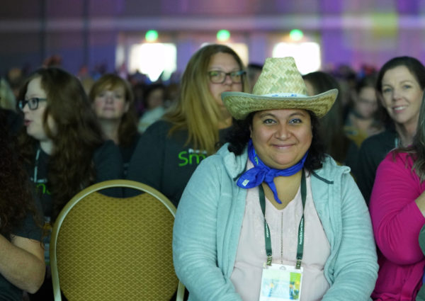 Pretty smile from attendee awaiting the general session