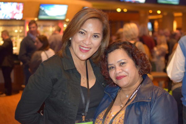 Smiling attendees during Welcome night event